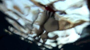 Lada Poleshuk bathes hot in pool, wet and underwater.