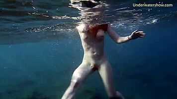 In Tenerife, Hot Ginger Teen 18+ Swims Underwater, Showing Off Bikini in Public Pool Scene