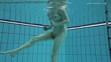 Lada Poleshuk bathes hot in pool, wet and underwater.