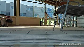 Roxalana swims in pool exposing tight pussy