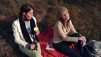 Skinny petite lesbians fuck outdoors.