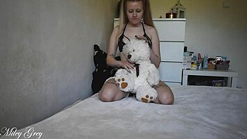 Naughty Girl Rides Teddy Bear. Blonde With Long Hair.