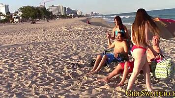 Bikini step in group oral scene