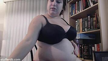 Curious teen enjoys tiramisu cake with belly fetish focus.