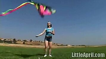 Teen rubbing her clit outdoors and sucking a popsicle - little 18+ april masturbates her pussy.