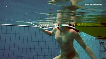 Petite 18+ brunette pornstar Alla swims naked in the hot pool, showing off her horny tits and ass while smoking