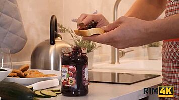 Handsome guy makes breakfast while wife worships his ass in kitchen.