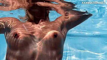 Hungarian blonde skinny pornstar enjoys swimming in the pool