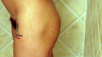 Tiny brunette enjoys a relaxing hot shower