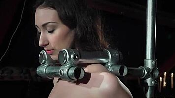 Submissive teen slave endures deepthroat blowjob and spanking before cumshot in bondage wood