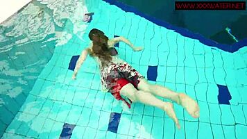 Hairy ginger Polish teen 18+ swims naked in pool underwater, showing tits in bikini