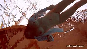 big tits redhead lola goes nude underwater in pool with friend