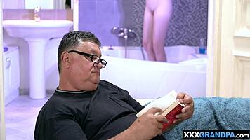 big boobed blondie suggestively cares for dirty old man's cock