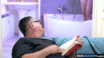 big boobed blondie suggestively cares for dirty old man's cock