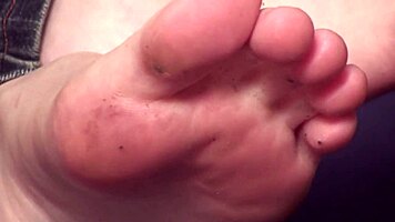 Young femdom makes him suck and lick her toes and feet