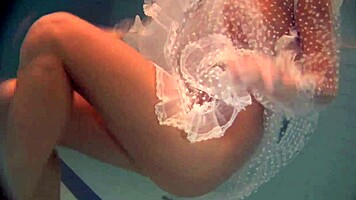 Russian Babe Natalia Swims And Strips