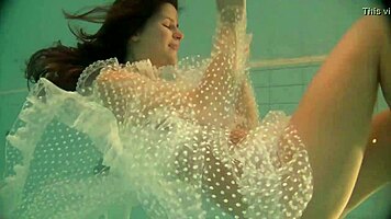 Russian Babe Natalia Swims And Strips