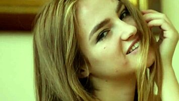 Erotic teen shows off naked sensuality on sofa