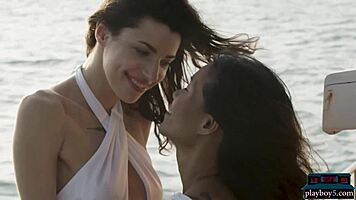 Petite asian and russian model on boat trip with ripped clothes.