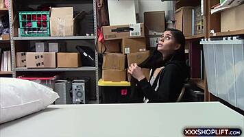 A mall security officer dressed as Santa clause deals with a young store cretin