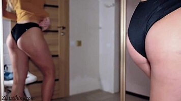 Babe with big boobs fingers her pussy. She cums hard in front of the mirror.