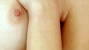 Glamorous brunette poses naked in close-up