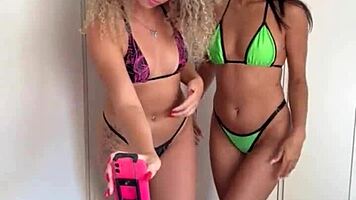 influencer brunette with piercing gets attention from curly blonde