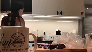 Young amateur wife does dishes while voyeur cam captures her in tight leggings and thong