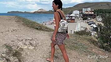 peeing publicly near beach with crowd watching