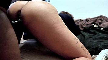 She struggles to talk while getting pounded doggystyle. Backstage, her pierced nipples shine as she screams.