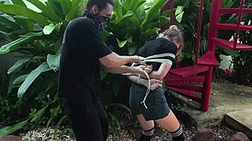 Beauty from the park gets tangled up in wild outdoor bondage. Can't believe how she moans with every tickle!