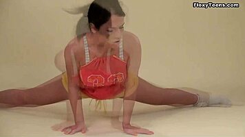 Polina Barna, brunette teen 18+, shows off big saggy tits. She’s flexible during yoga workout.