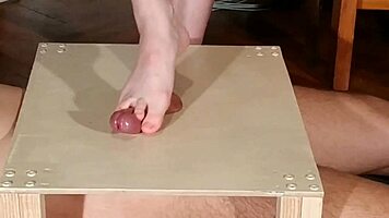 Watch domina stomp cock with bare feet! Footjob madness!