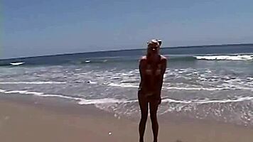 want to see this little blonde showing her natural tits and pussy at the beach?