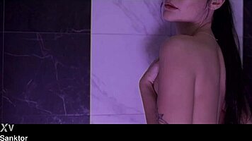 Sasha Sparrow strips and masturbates in the shower, teasing her small tits and wet pussy