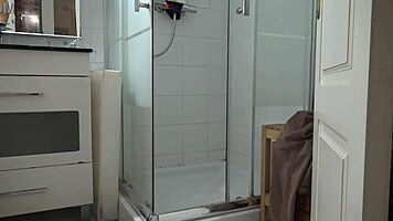 Stepson spies on stepmom’s morning shower, stroking hard.