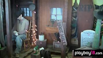 Lisa Seiffert poses naked outdoors with ripped clothes.