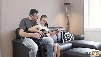 Old Guitarist Allows Young Fan to Explore His Instrument Emotionally