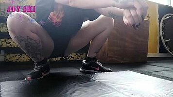 Alternative Girl Stretching At The Gym