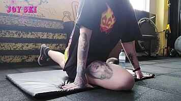 Alternative Girl Stretching At The Gym