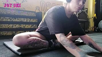 Alternative Girl Stretching At The Gym