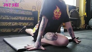 Alternative Girl Stretching At The Gym