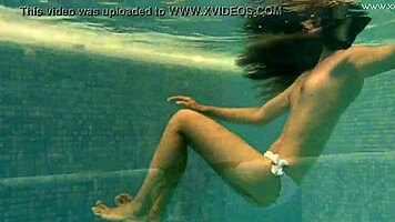 Irina Russaka Bathes Underwater In Pool, Showing Small Tits.