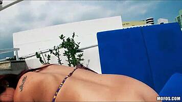 Sun Bathing Beauty Shifts Bikini for Outdoor View