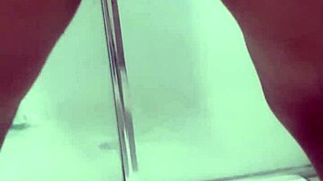 Teen bends over for juicy squirt in bathroom stall