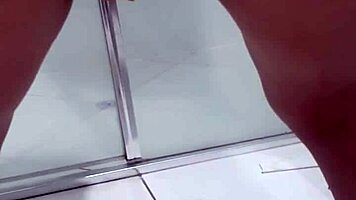 Teen bends over for juicy squirt in bathroom stall