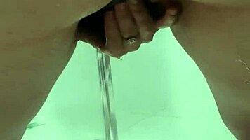 Teen bends over for juicy squirt in bathroom stall