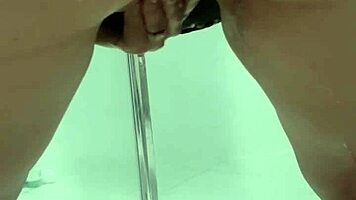 Teen bends over for juicy squirt in bathroom stall