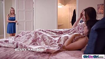 Stepmom just stares as stepdaughter licks her girlfriend's face in bed