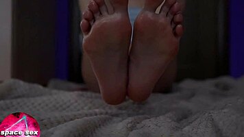 Teen girl plays with oiled feet in close-up fetish